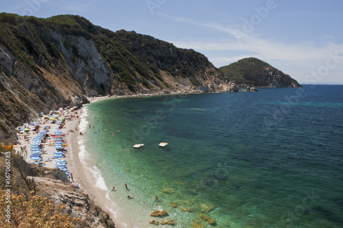Fototapeta Naklejka Na Ścianę i Meble -  The  beach of Sansone at the elba island. On the background Capo d'Enfola. Italy