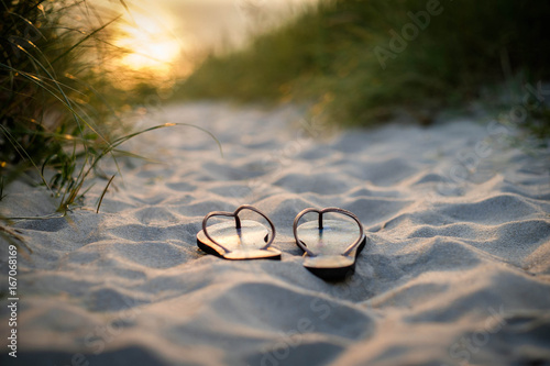 Flip Flops on the beach at sunset