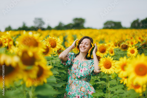 A girl attached sunflowers to her ears
