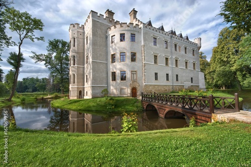 Neo-Gothic style castle surrounded by a moat in Karpniki, Poland