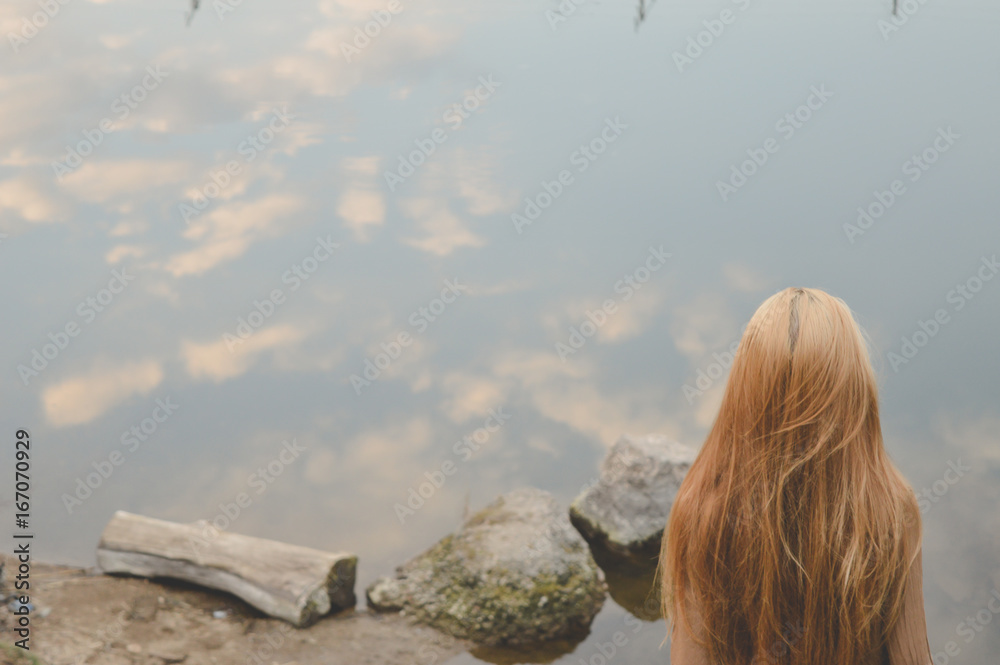 Girl near water and bridge 