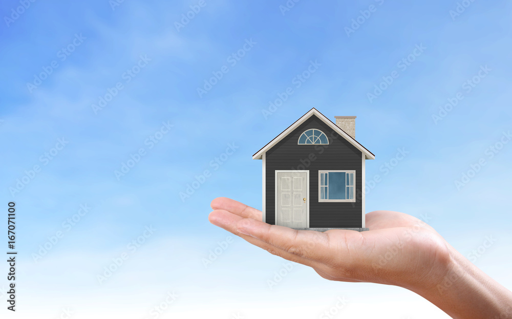 Mortgage concept by house in hand Mortgage concept by house in hand