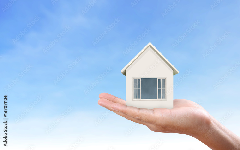 Mortgage concept by house in hand Mortgage concept by house in hand