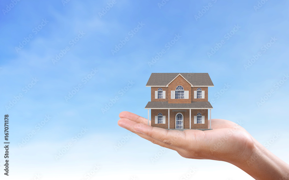Mortgage concept by house in hand Mortgage concept by house in hand