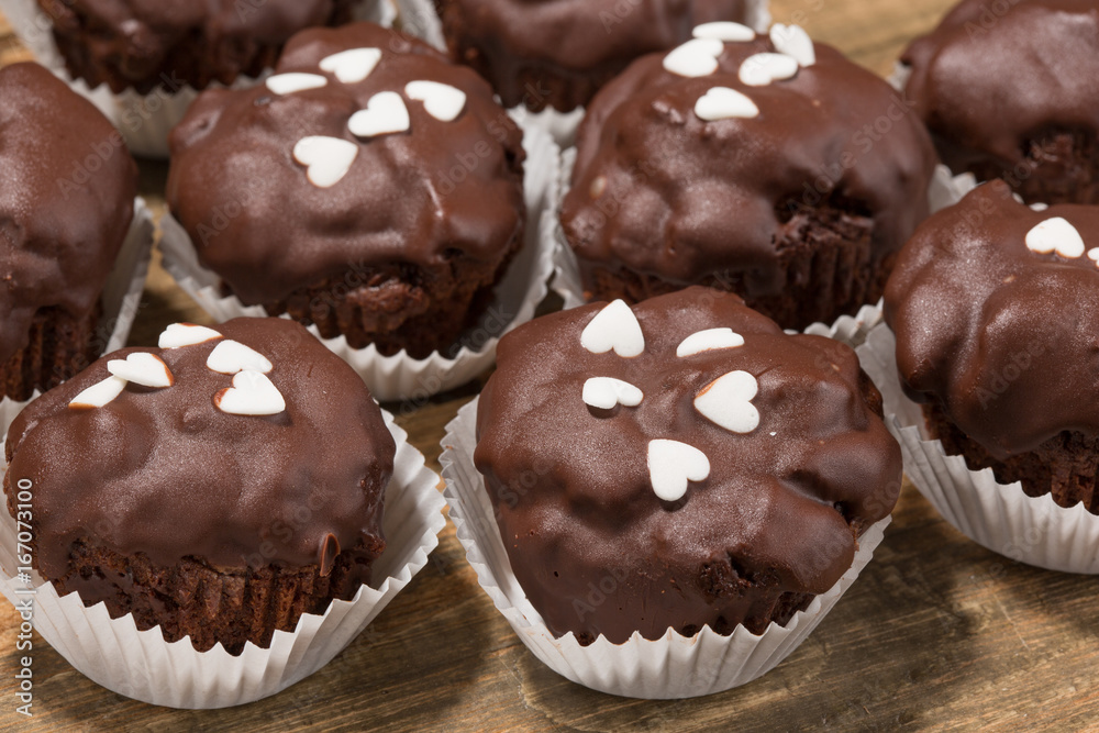 Cupcakes, muffins on a wooden table Cupcakes, muffins on a wooden table