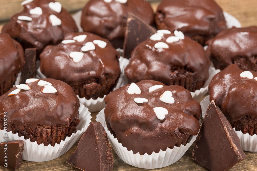 Cupcakes, muffins on a wooden table Cupcakes, muffins on a wooden table