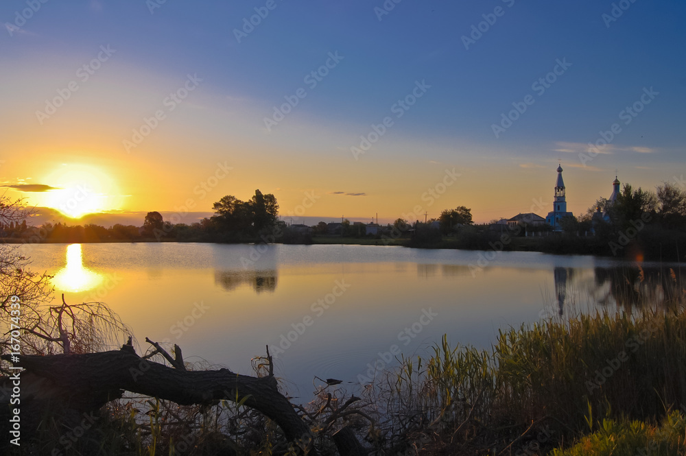 Dawn over the lake with the church