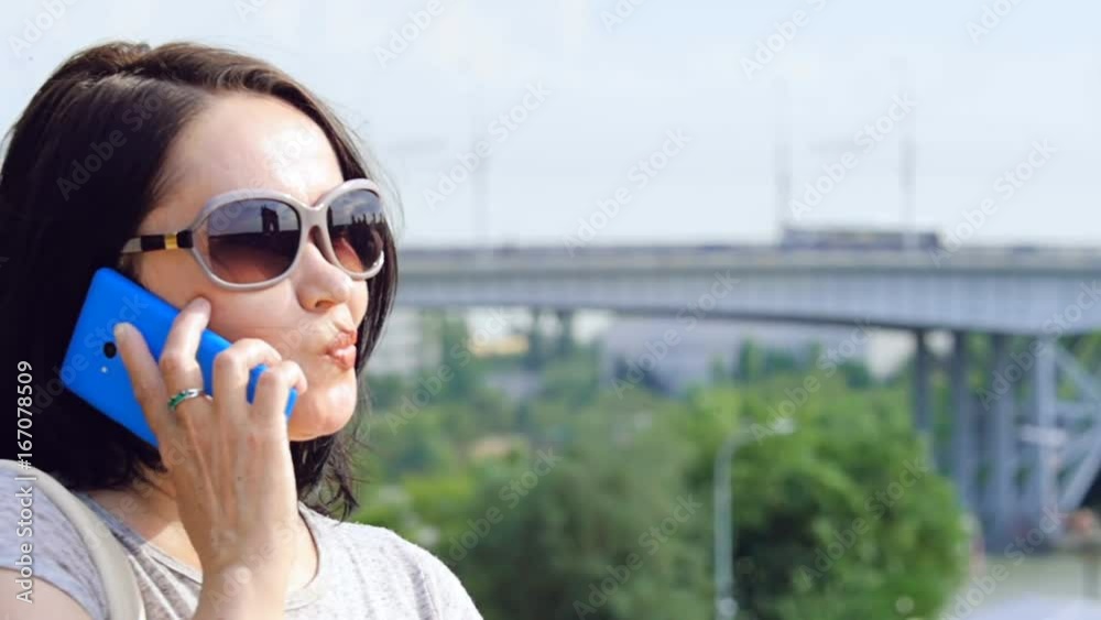 The woman is talking on the phone. The woman is talking on the phone.