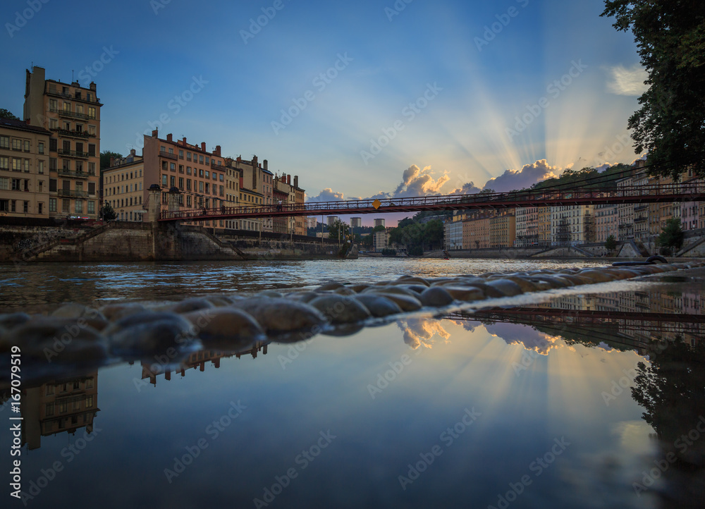 Sunset after the rain at the Stone river in Lyon, France. Sunset after the rain at the Stone river in Lyon, France.