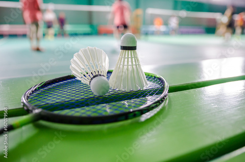 shuttlecock on badminton racket.