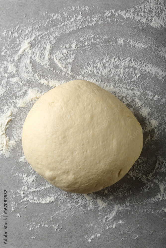 Ball of pizza dough with dusting flour Ball of pizza dough with dusting flour