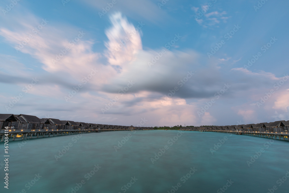 View of a tropical resort at sunset.