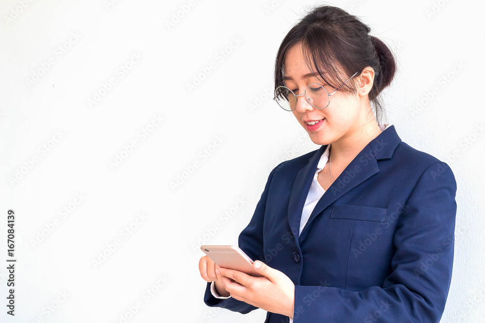 Female business people between the ages of 25-40 years, looking at the phone at work. Female business people between the ages of 25-40 years, looking at the phone at work.