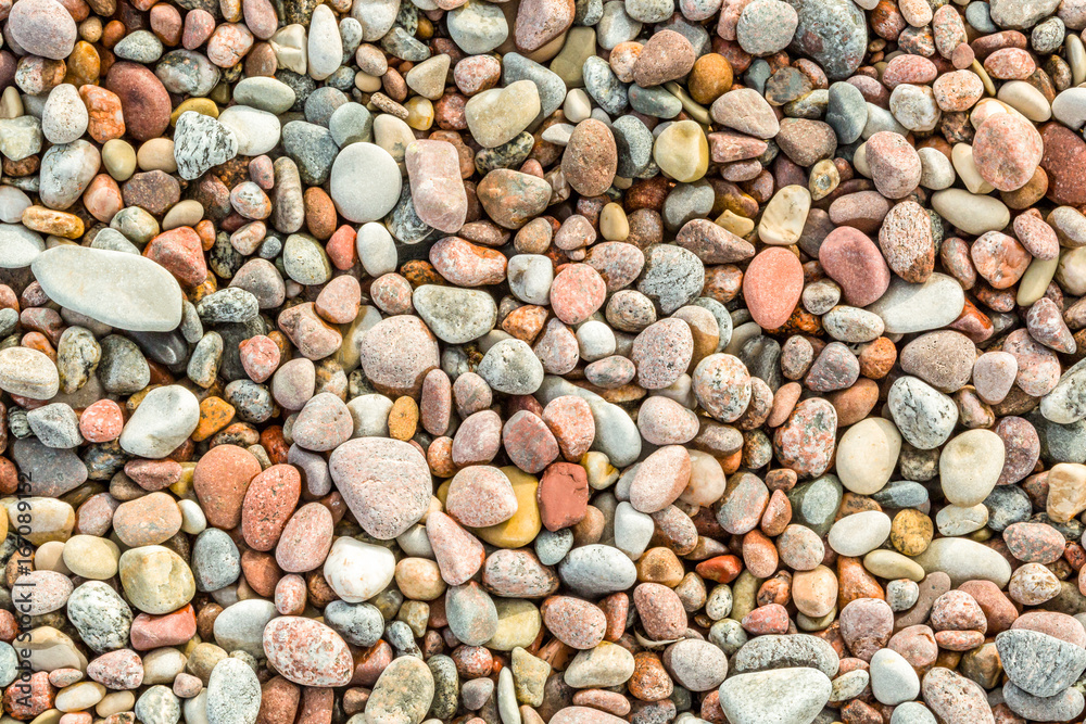 Many round and smoth colorful pebbles seen from above. Many round and smoth colorful pebbles seen from above.