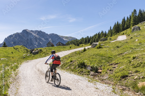 Mountainbiker in Carnic Alps with view to mountain Rosskofel © photoflorenzo