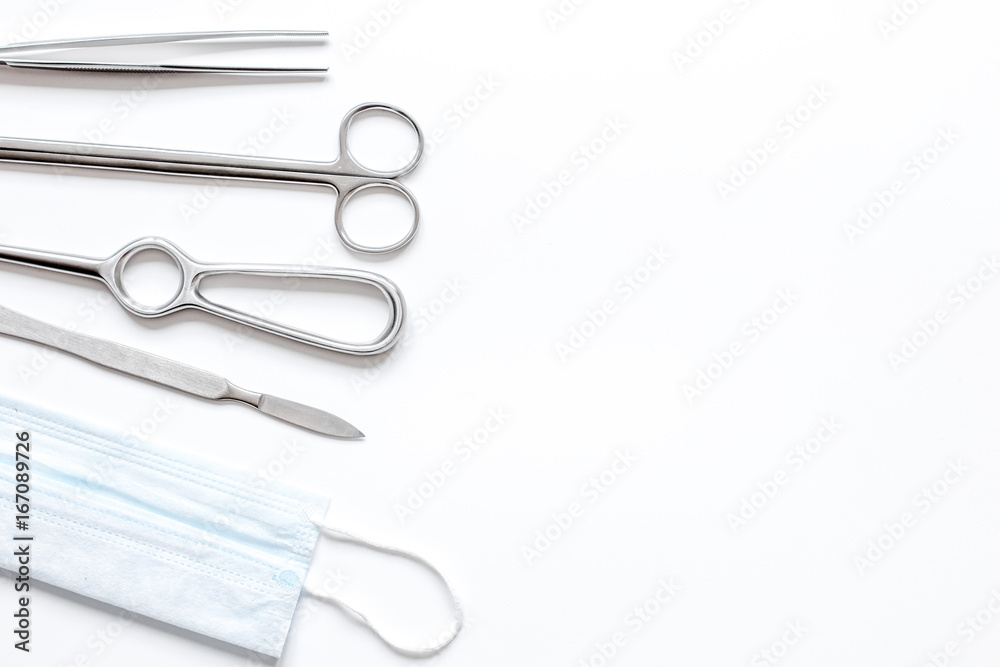 instruments for plastic surgery on white background top view instruments for plastic surgery on white background top view