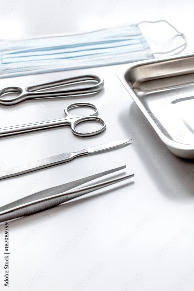 instruments for plastic surgery on white background
