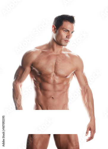 Muscular bodybuilder guy standing and posing on white background
