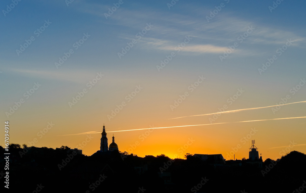Obraz premium Church silhouette at colorful scenic sunrise