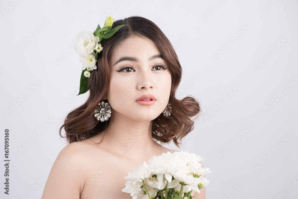 Beautiful asian woman bride on grey background. Closeup portraits with a professional makeup Beautiful asian woman bride on grey background. Closeup portraits with a professional makeup