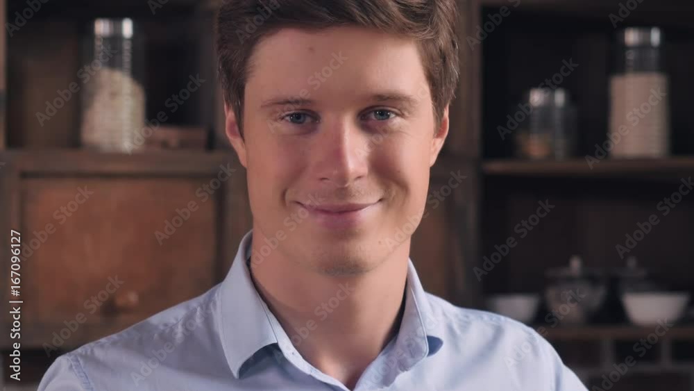 Portrait handsome caucasian man posing looking at the camera. Cheering guy wearing blue shirt. Portrait handsome caucasian man posing looking at the camera. Cheering guy wearing blue shirt.
