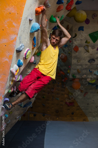 Climber trains at the climbing wall.