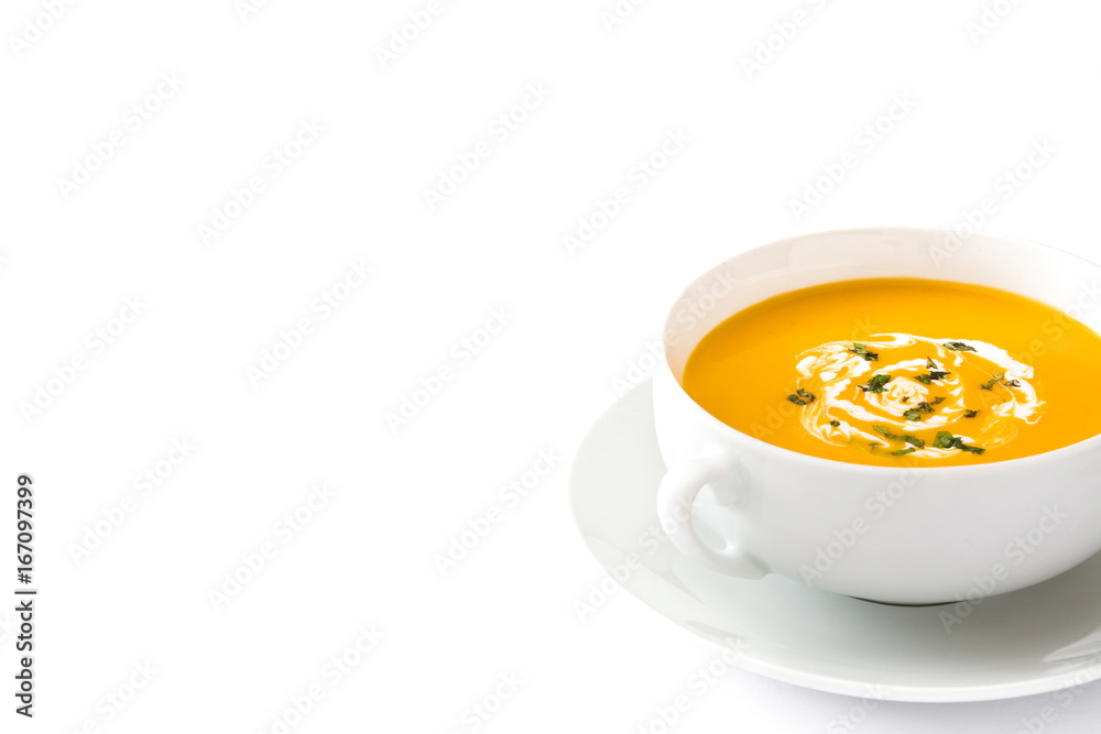Pumpkin soup in white bowl on wooden table
Pumpkin soup in white bowl on wooden table