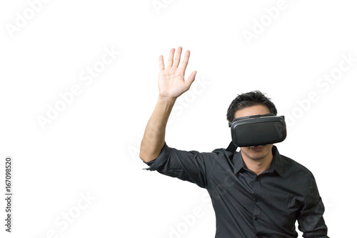 Young man using a VR headset and experiencing virtual reality isolated on white background with clipping path