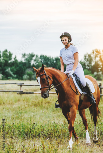 Girl jockey riding a horse © sergo321