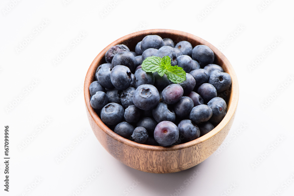 close up blueberry with vanilla mint in a wooden bowl isolated on white background
close up blueberry with vanilla mint in a wooden bowl isolated on white background