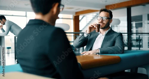 Business colleagues having conversation during coffee break
