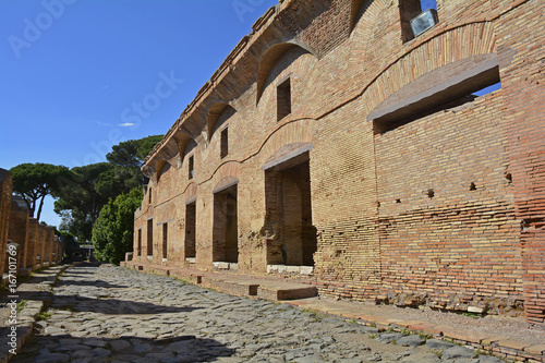 Canvas Print The ruins insulae apartment buildings in Ostia Antica, Rome's ancient port before the river silted, it fell into decay and was abandoned in the 9th century