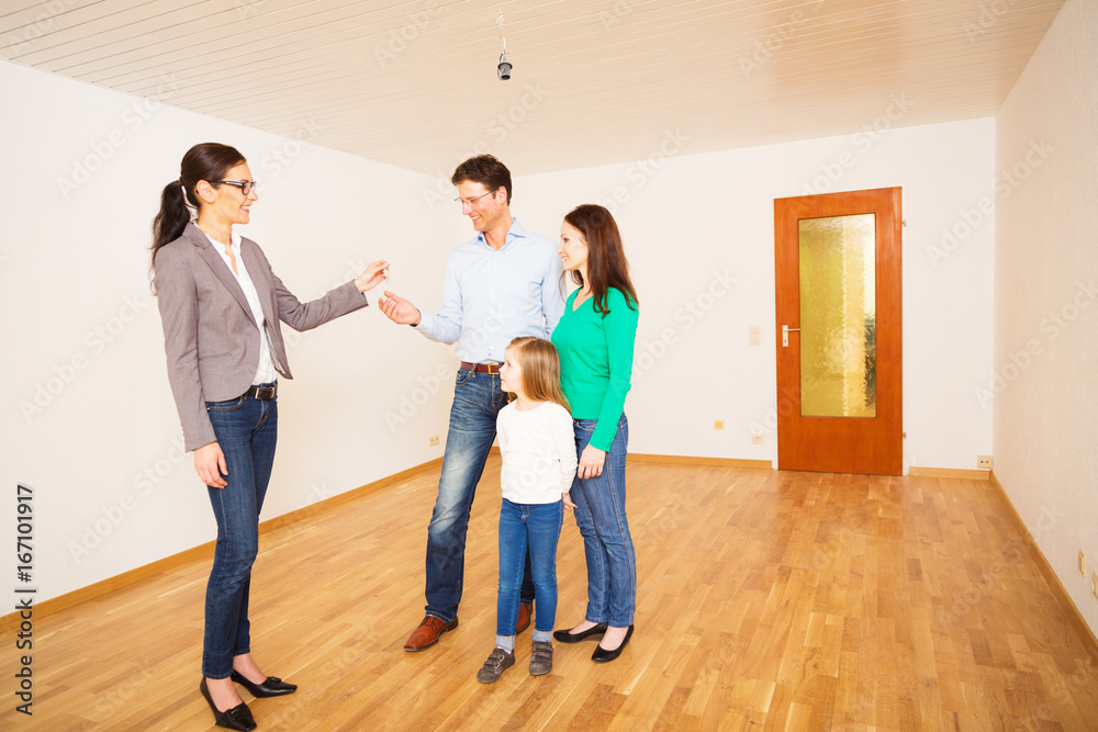Fototapeta premium Realtor Giving Customers The Key To Their New Flat