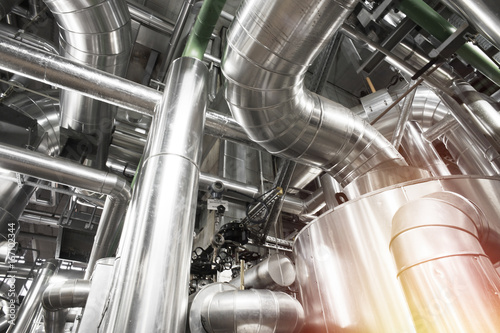 Equipment, cables and piping as found inside of a modern industrial power plant