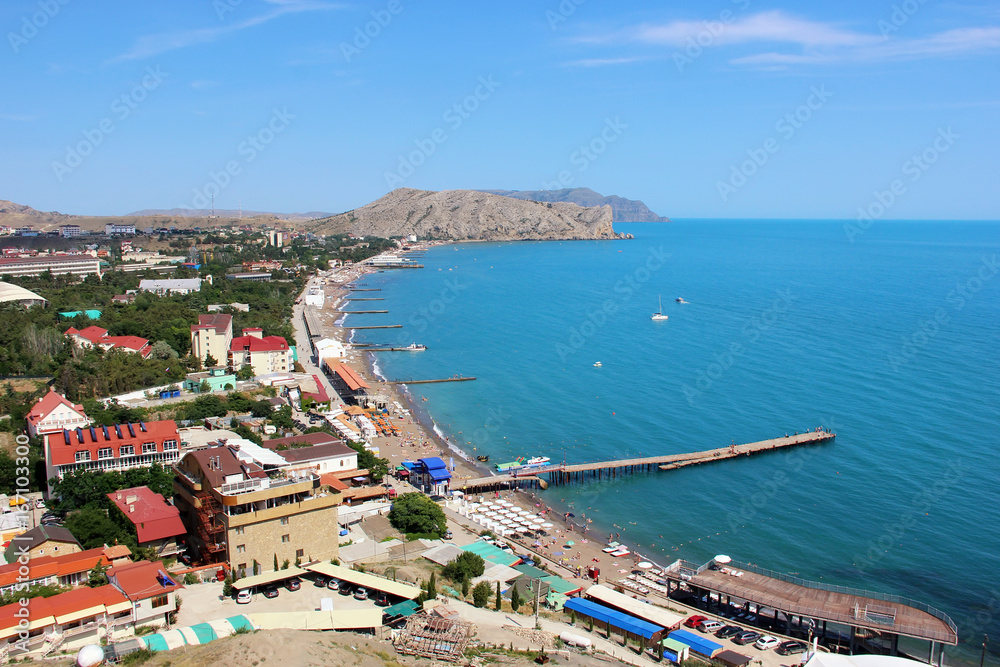 The beach town of Sudak in Crimea, the view from the top of the mountain on a Sunny day.