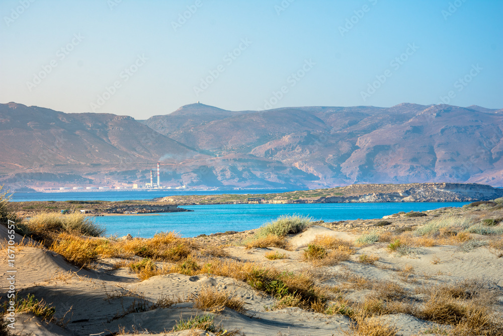 Amazing view of Koufonisi island with magical turquoise waters, lagoons, tropical beaches of pure white sand and ancient ruins on Crete, Greece