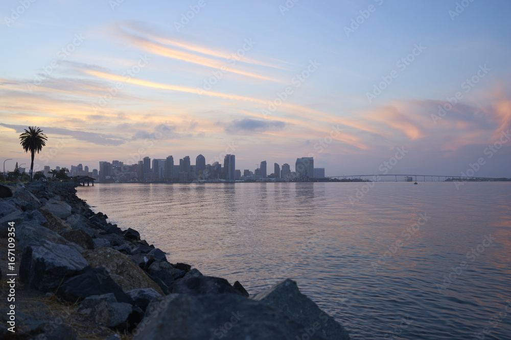 sunrise over San Diego and Coronado Bay as a tanker passes under the Coronado Bridge