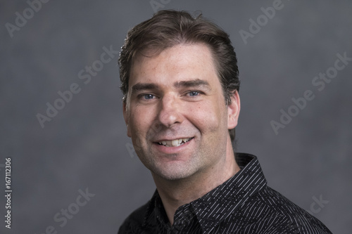 Portrait of a man smiling, close up © Burlingham