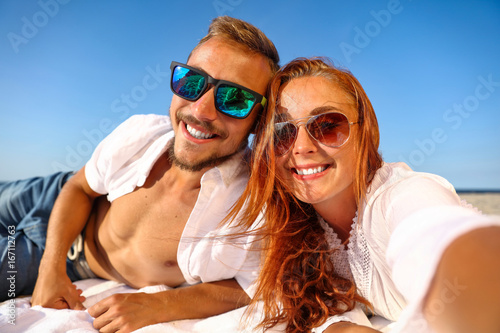 selfie of two lovers on beach 