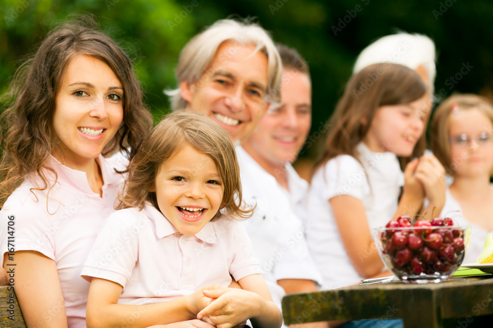 Big Family Having A Picnic In The Garden Big Family Having A Picnic In The Garden