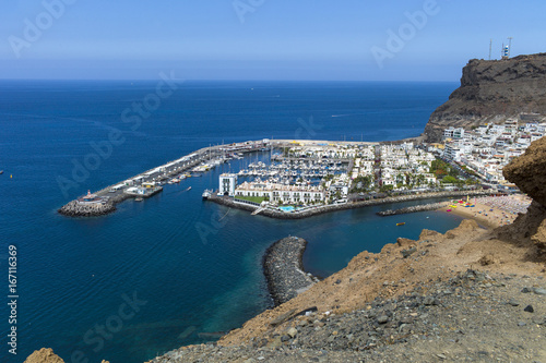 Fototapeta Naklejka Na Ścianę i Meble -  Old town, harbor of historic town Mogan Gran Canaria at perfect sunny weather with blue skies in the morning.