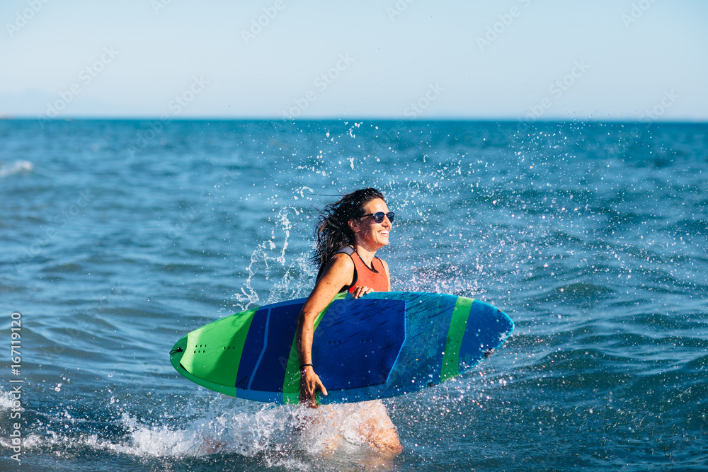 Young woman surfing 