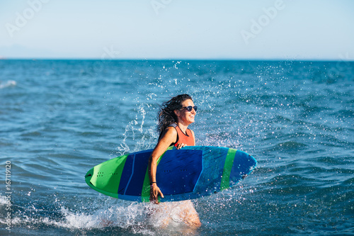 Young woman surfing 