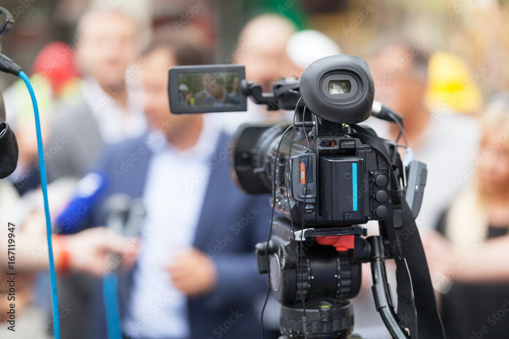 News conference. Shooting media event with a video camera. News conference. Shooting media event with a video camera.