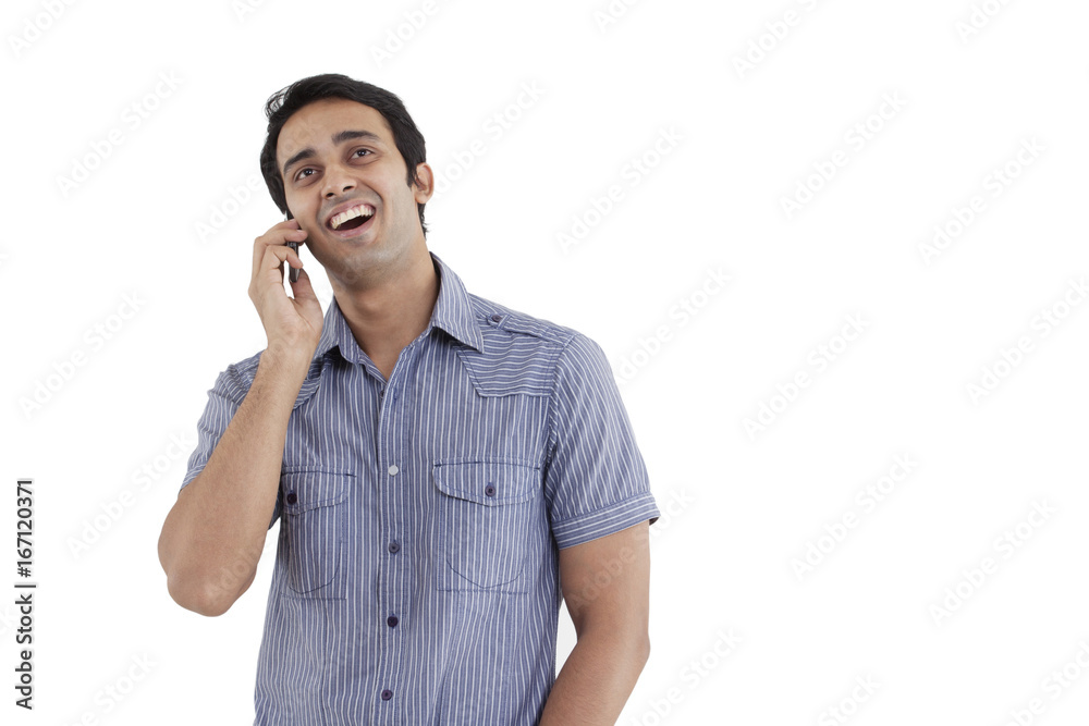 Man laughing while having conversation on phone Man laughing while having conversation on phone