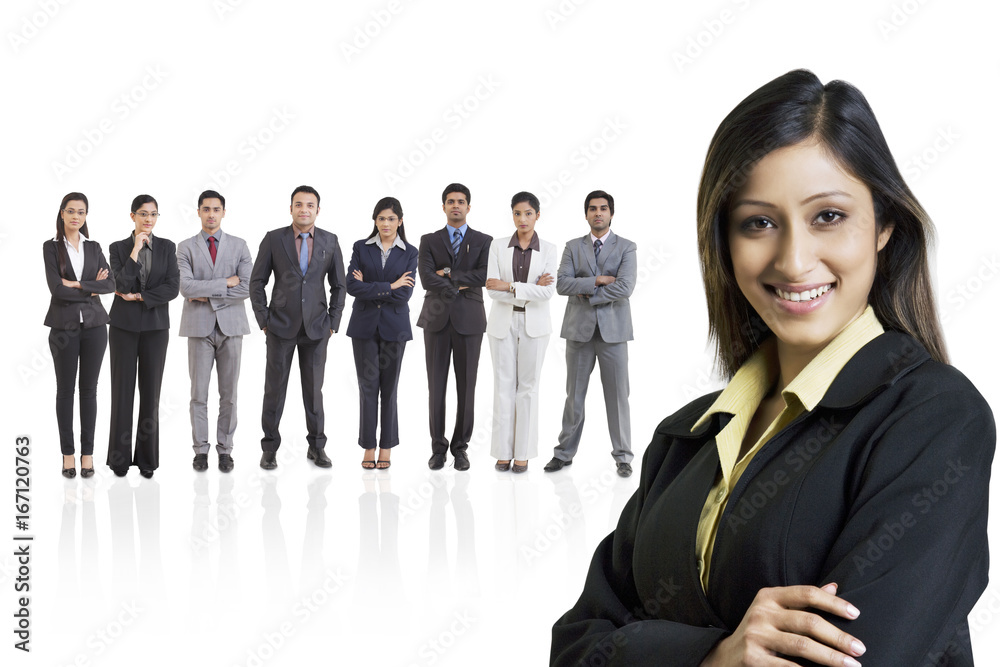 Portrait of businesswoman smiling with businesspeople in background Portrait of businesswoman smiling with businesspeople in background