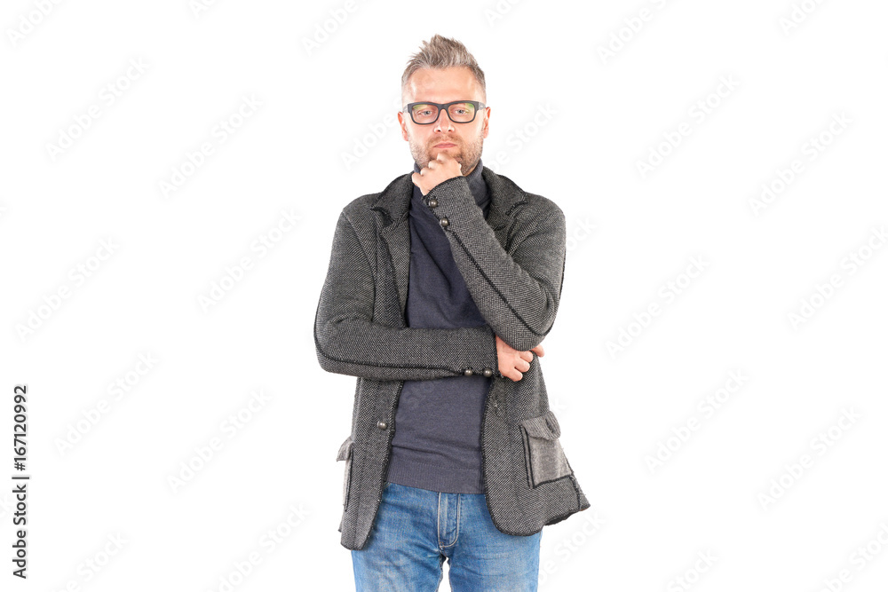 Studio portrait of middle aged man wearing casual clothing and eyeglasses