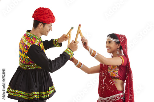 Couple with sticks dancing  photo