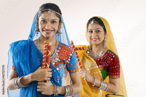 Gujarati women with dandiya sticks 