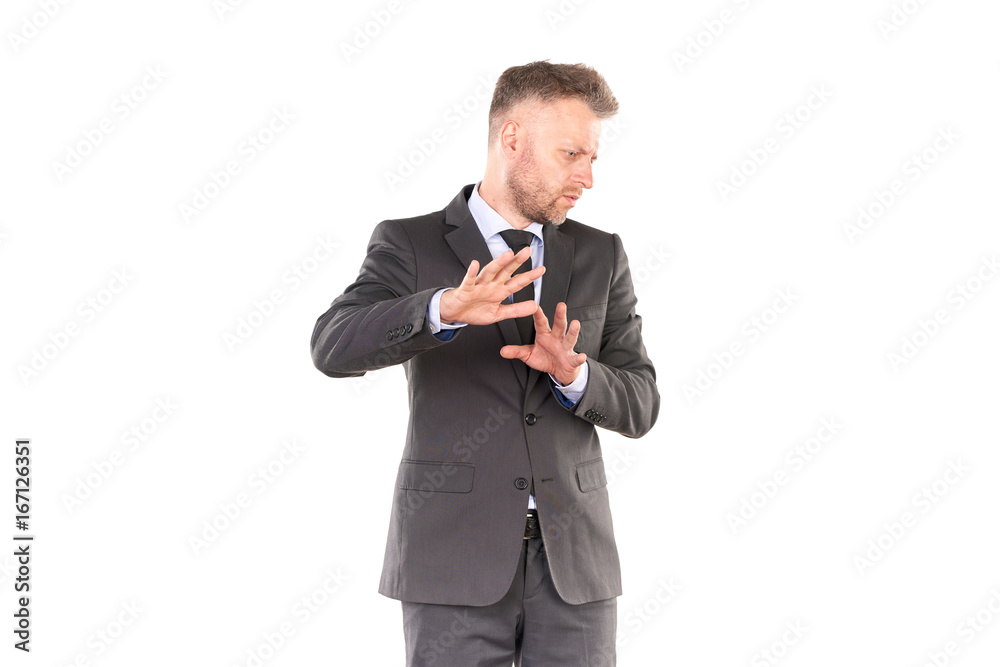Portrait of middle-aged businessman in elegant suit posing against white background Portrait of middle-aged businessman in elegant suit posing against white background